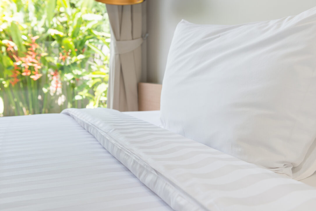 White pillow and white bed in bed room